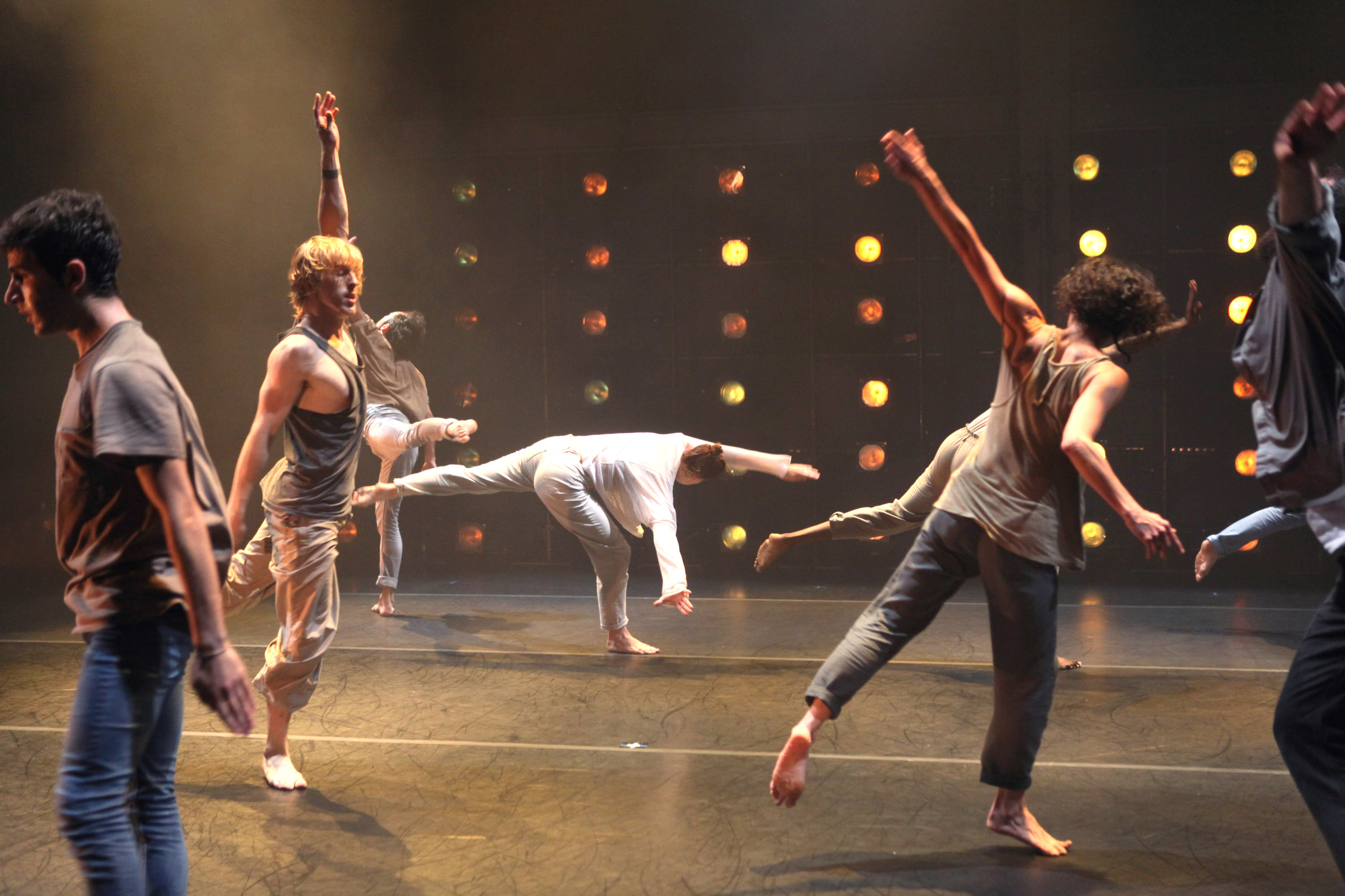 Dancer jumping and dancing in different directions on stage
