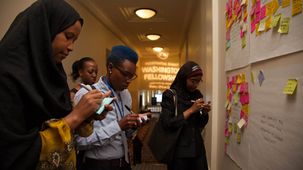 Mandela Washington Fellows brainstorming at the feedback wall.