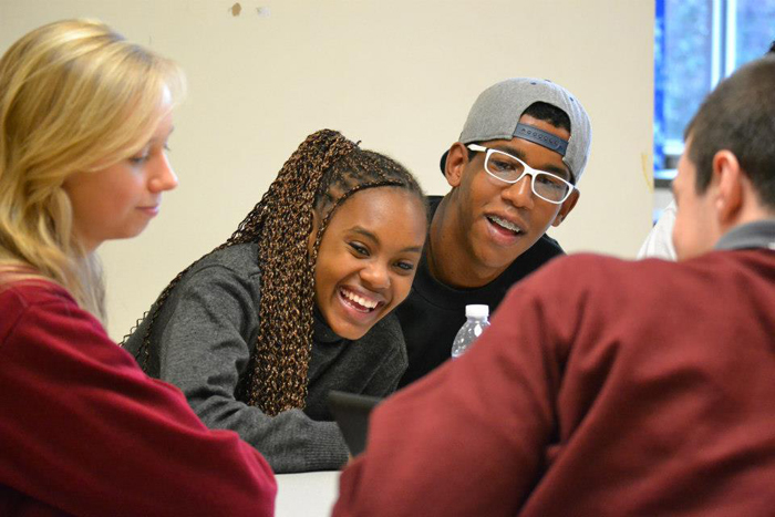 The Brazilian visitors use their English skills to talk with American peers at a local high school.