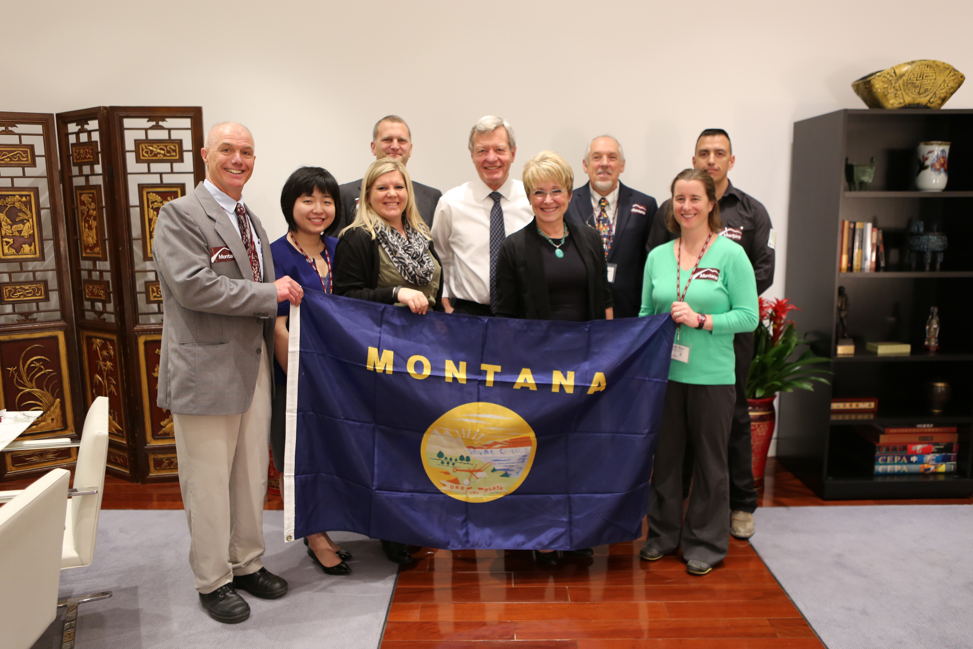 U.S. Ambassador to China Max Baucus, a former Senator from Montana, meets with the Sport for Social Change group at the U.S. Embassy in Beijing.