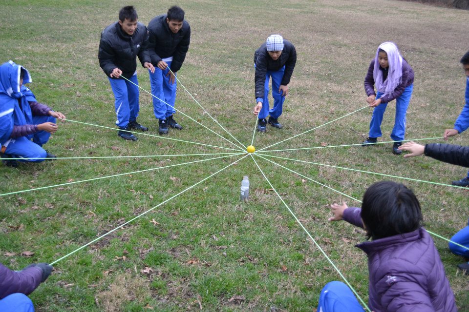 The delegation works together during a teambuilding exercise.