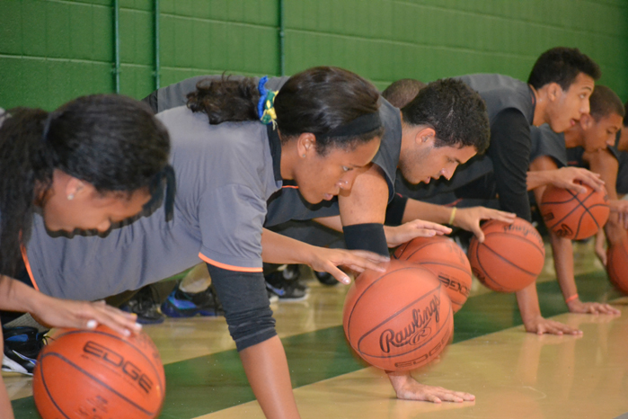 The Brazilian visitors work on dribbling by performing one-handed push-ups.