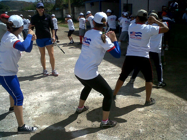Teenage softball players from Nicaragua work on batting stances after receiving key instructions from Jess Mendoza. 