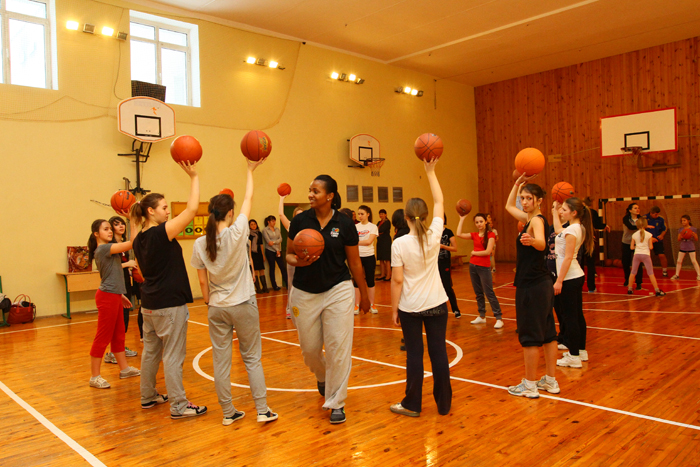 The girls basketball team works with Tamika Raymond on drills and skills.