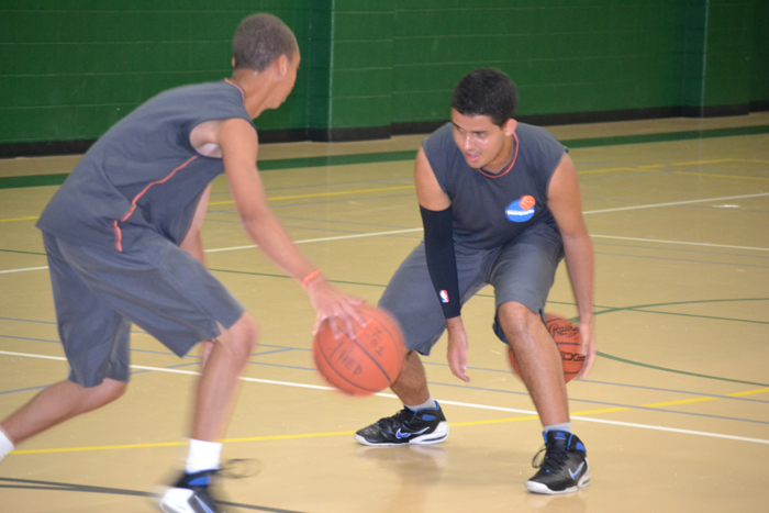 The Brazilian youth basketball players practice dribbling while warming up for a full-day of basketball clinics.