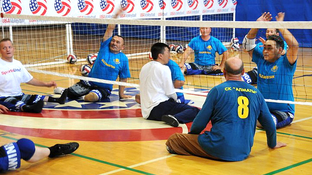 Kazakhstan sitting volleyball athletes go through their first training session with the U.S. Women's national team coach Bill Hamiter.