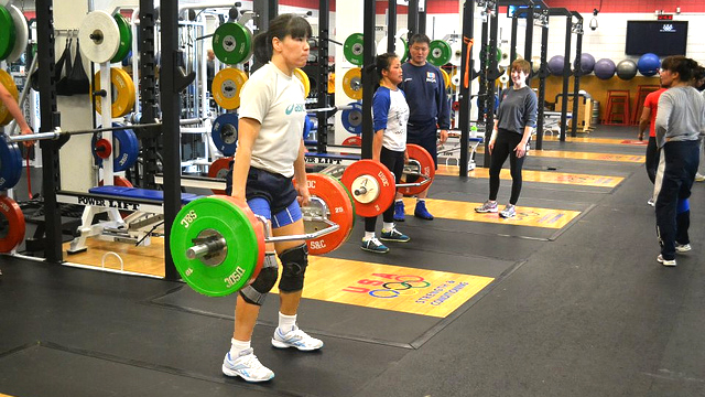 Mongolian wrestlers lift weights at the U.S. Olympic Training Center in Colorado.