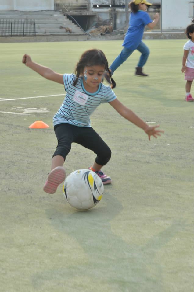 A young player practices her ball handling skills during a GO GIRL clinic