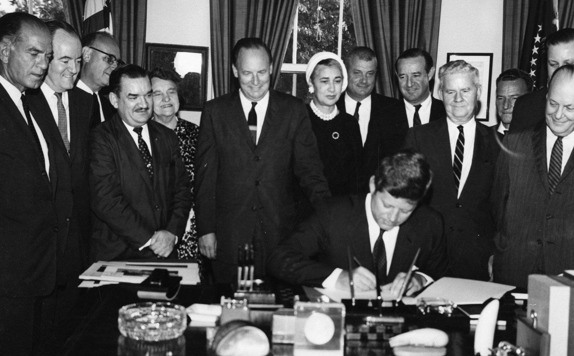 The Fulbright-Hays legislation was enacted by the 87th U.S. Congress on September 21, 1961. Here, President John F. Kennedy signs the bill into law while Sen. Fulbright (left) and others look on.