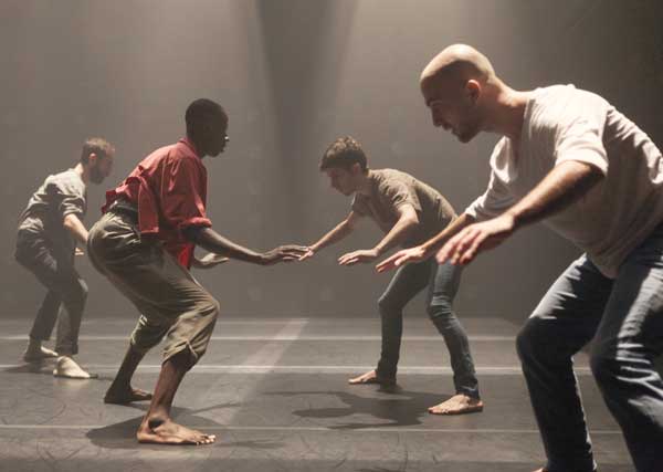 Dancers standing and facing each other