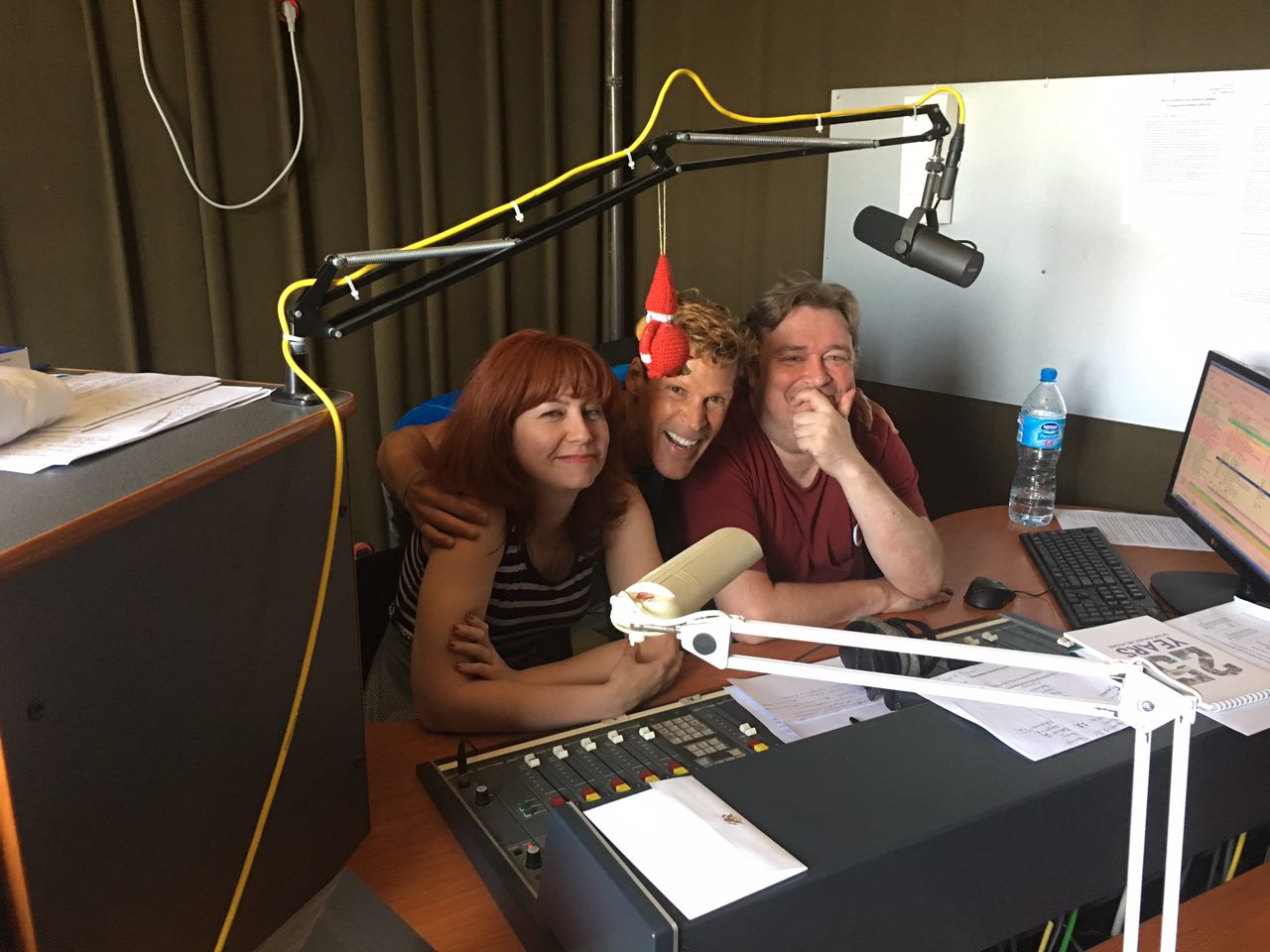 Dean behind the radio show microphone