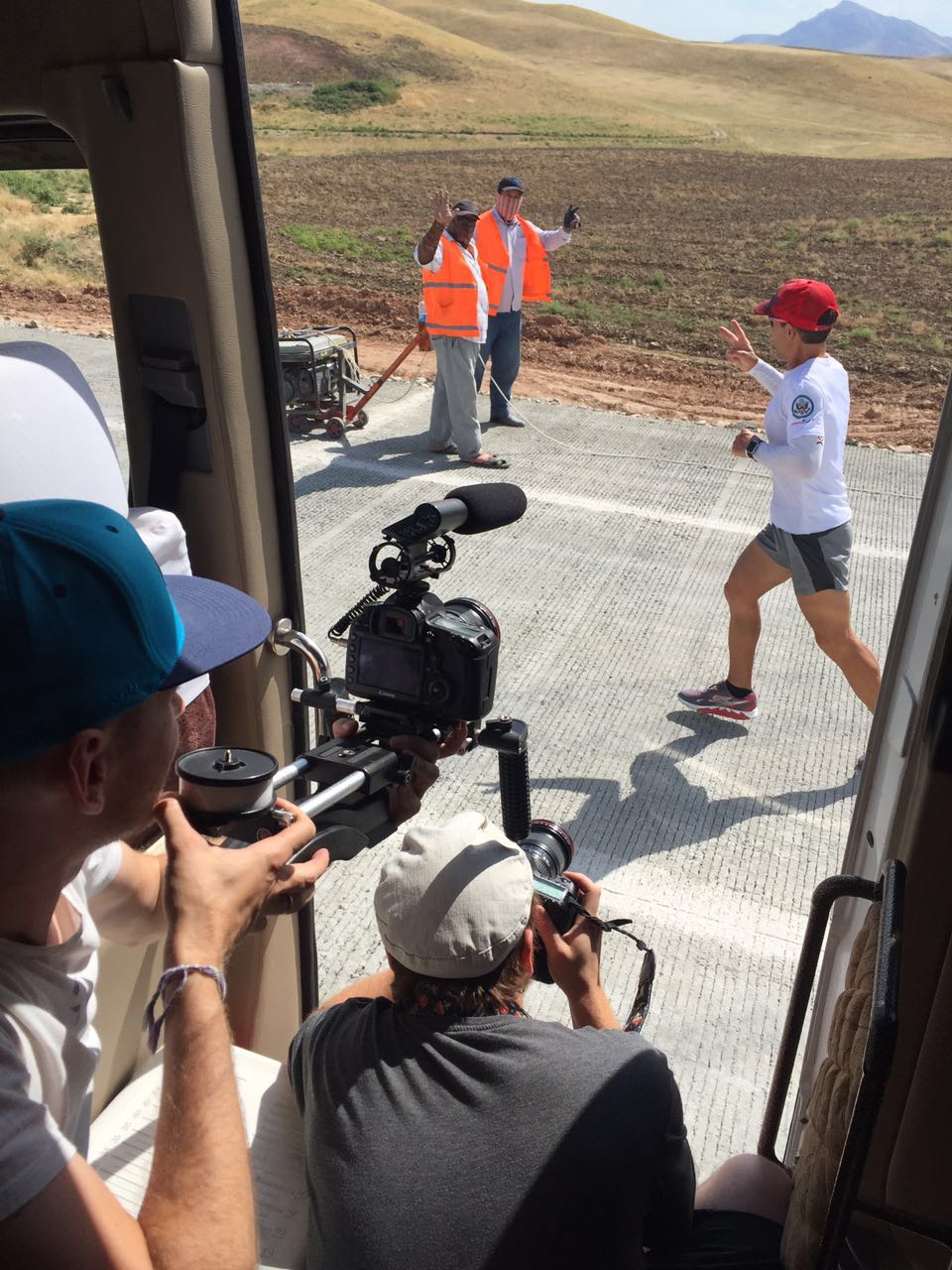 the crew takes a picture of Dean as he waves to bystanders