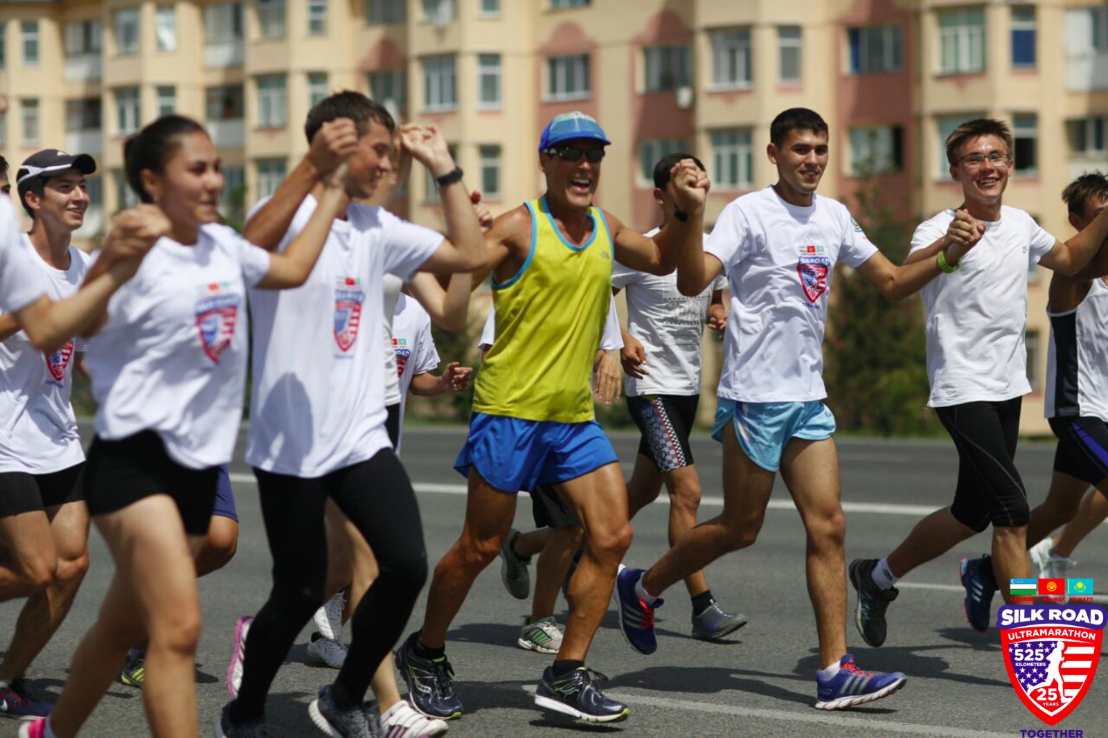 Dean and the group running with hands in hair 