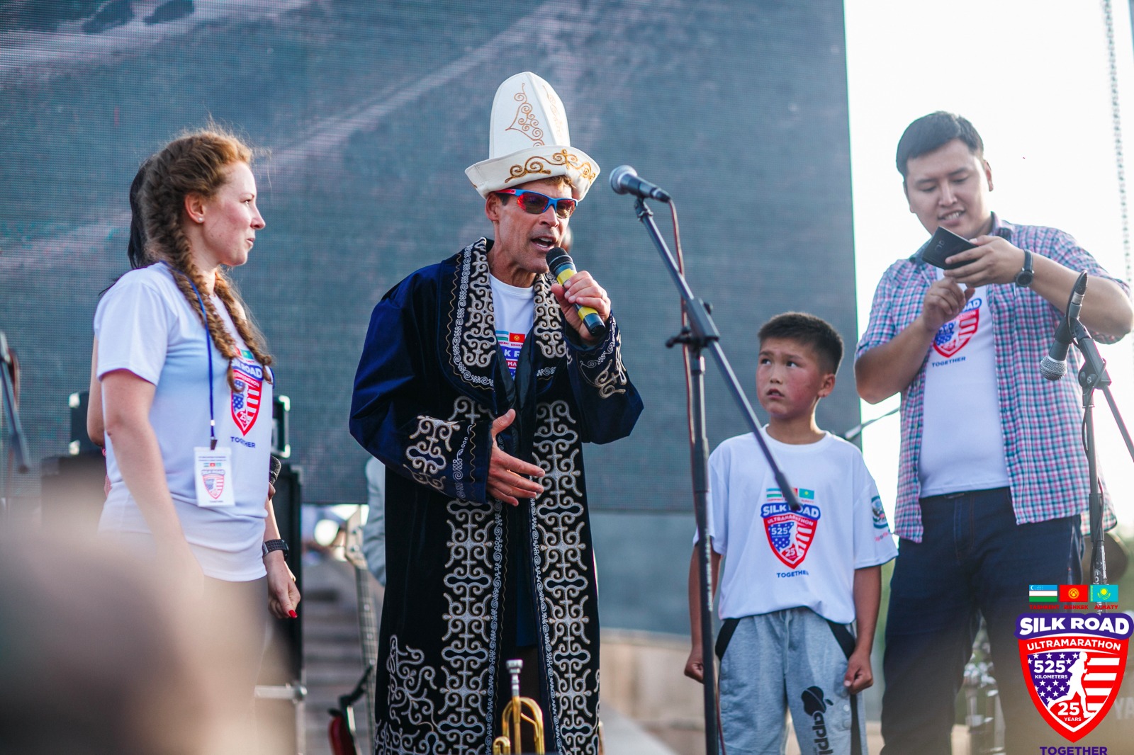 Dean wearing Kyrgyz hat and a chap (traditional chieftain robe)