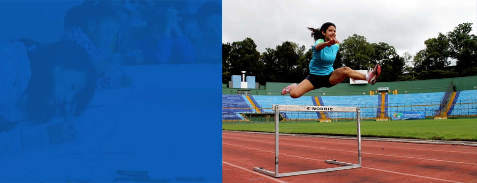 woman jumping over hurdle