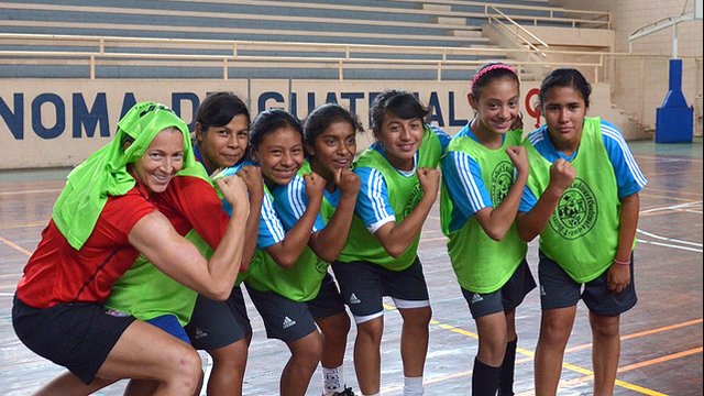 The Guatemalan soccer girls pose with Tracy Noonan.