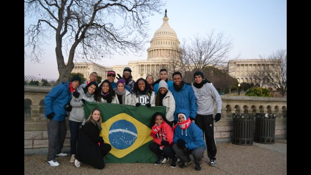 Thr group poses in front of the Capitol Building.