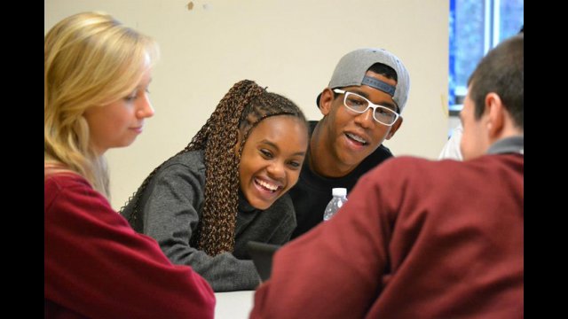 The Brazilian visitors use their English skills to talk with American peers at a local high school.