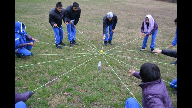 The delegation works together during a teambuilding exercise.