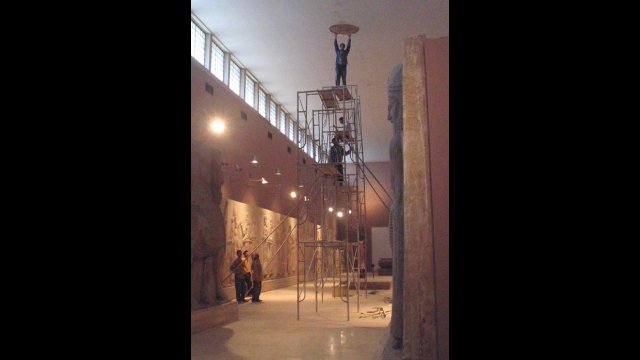 Contractors repairing the roof in the Assyrian Gallery under the Department of State infrastructure improvements initiative, February 2004