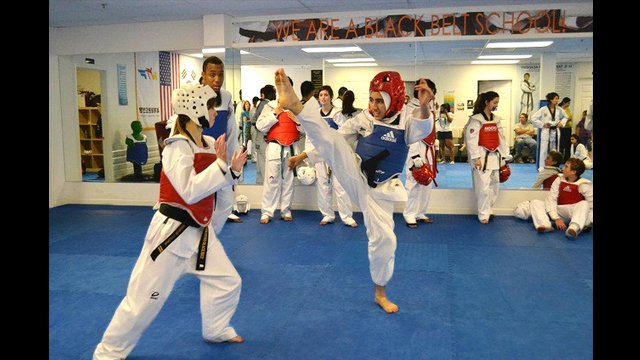 The taekwondo athletes demonstrate good kicking form in every session.