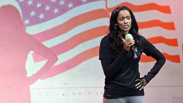 Current WNBA Player and USA 2012 Women’s Olympic Basketball Team Player Swin Cash speaks to a group of students in London.