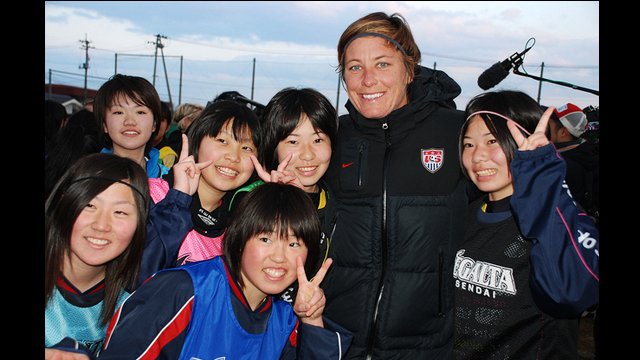 U.S. soccer forward, Abby Wambach, meets some potential future members of Japan's national soccer team.
