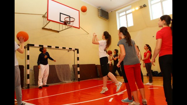 A young Ukrainian female launches a shot during practice.
