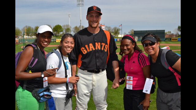 Hunter Pence of the San Francisco Giants and female coaches from the Dominican Republic and Venezuelan.