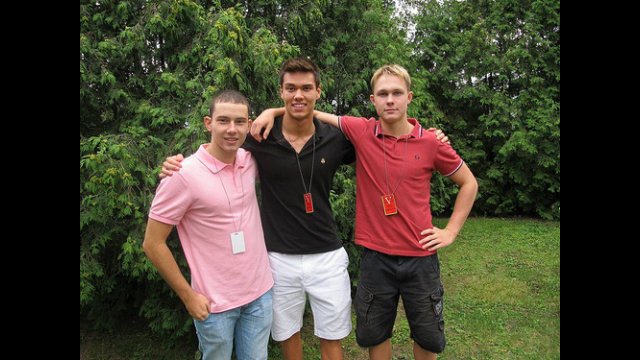 Russian and American swimmers pose for a photo during an event at the American Embassy in Moscow, Russia.
