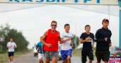 Dean runs past the town banner
